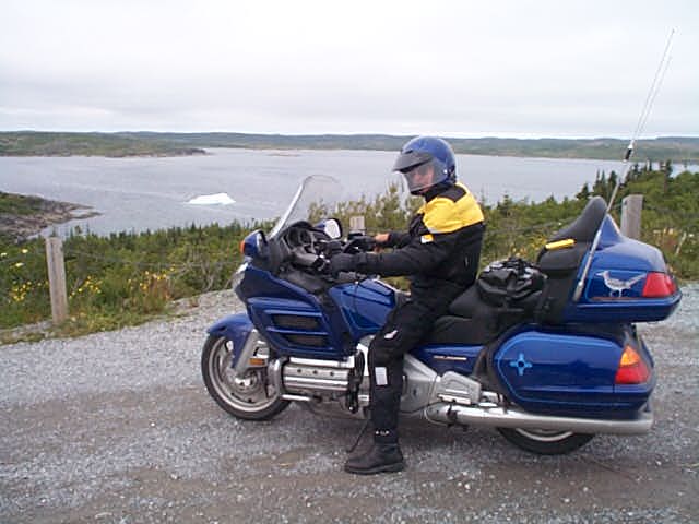 On Newfoundland coast, with Ice Berg in picturesqe bay